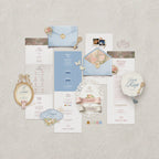 Enchanted Garden wedding website template flatlay, powder blue and blush pink Canva wedding website with gold frames, lace details and RSVP form, fairytale wedding website template