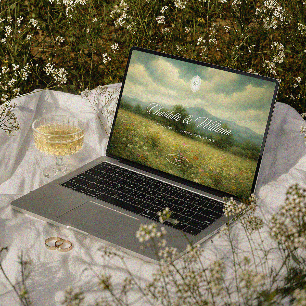 Twilight Meadow Canva wedding website template on laptop, moody oil painting landscape homepage, cinematic and romantic wedding website template